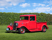 AUT 14 RK1790 01
1934 Ford Pickup Red 3/4 Front View On Grass By Shrubs
