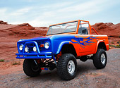 AUT 14 RK1803 01
1964 Ford Bronco Orange With Blue Flames 3/4 Front View On Gravel By Red Rock