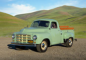 AUT 14 RK1804 01
1949 Studebaker 2R5 Pickup Green 3/4 Front View On Gravel By Hills