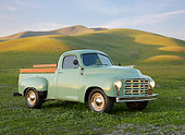 AUT 14 RK1805 01
1949 Studebaker 2R5 Pickup Green 3/4 Front View On Grass By Hills