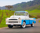 AUT 14 BK0003 01
1957 Dodge Sweptside Pickup Truck Blue And White 3/4 Front View On Road By Vineyard