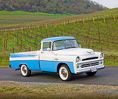 AUT 14 BK0005 01
1957 Dodge Sweptside Pickup Truck Blue And White 3/4 Front View On Road By Vineyard