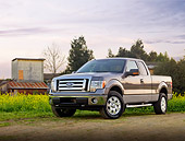 AUT 14 BK0009 01
2009 Ford F-150 Supercab XLT Pickup Truck Gray 3/4 Front View On Dirt By Field And Buildings