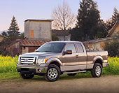 AUT 14 BK0010 01
2009 Ford F-150 Supercab XLT Pickup Truck Gray 3/4 Front View On Dirt By Field And Buildings
