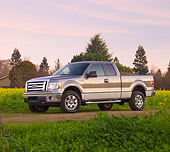 AUT 14 BK0012 01
2009 Ford F-150 Supercab XLT Pickup Truck Gray 3/4 Front View On Dirt Road