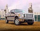 AUT 14 BK0013 01
2009 Ford F-150 Supercab XLT Pickup Truck Gray 3/4 Front View On Dirt By Plant
