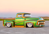 AUT 14 BK0030 01
1956 Ford F-100 Pickup Truck Custom Green And Gold 3/4 Front View On Pavement By Hills