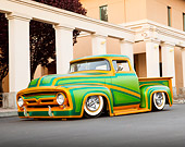 AUT 14 BK0031 01
1956 Ford F-100 Pickup Truck Custom Green And Gold 3/4 Front View On Pavement By Columns And Building