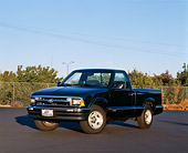 AUT 14 RK0017 03
1997 Chevrolet S-10 Standard Cab Green 3/4 Front View On Pavement Trees Blue Sky