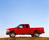 AUT 14 RK0041 01
1999 Ford F250 XLT Super Duty 4x4 with Triton V10 Red Profile View On Dirt