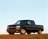 AUT 14 RK0048 03
1999 Chevy Silverado LS 1500 Blue Pick Up Low 3/4 Side View On Dirt Hill Blue Sky