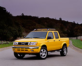 AUT 14 RK0063 02
2000 Nissan Frontier Crew Cab SE Prototype Yellow Pick Up Truck 3/4 Front View On Pavement