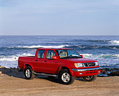 AUT 14 RK0067 07
2000 Nissan Frontier Crew Cab SE Prototype Red Pick Up Truck 3/4 Side View On Beach
