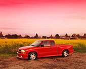 AUT 14 RK0075 03
1999 Chevrolet S-10 Extreme Pick Up Truck Red 3/4 Side View On Yellow Flower Field At Dusk