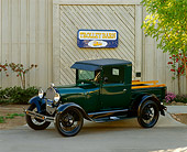 AUT 14 RK0112 01
1929 Ford Pickup Truck Green 3/4 Side View On Pavement By Fence