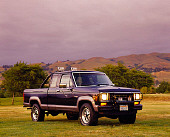 AUT 14 RK0128 01
1987 Ford Ranger XLT Supercab 4x4 Truck Black Front 3/4 View On Grass