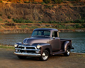 AUT 14 RK0142 03
1954 Chevrolet 3100 1/2 Ton Truck Gray 3/4 Front View On Dirt By Water