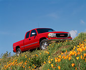 AUT 14 RK0190 02
1999 GMC Sierra Truck Red Low 3/4 Front View On Hill By Flowers