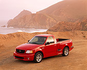 AUT 14 RK0255 01
1999 Ford F150 Lightning Truck Red 3/4 Front View On Sand
