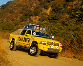 AUT 14 RK0261 14
2000 Dodge Dakota Quad Cab Dakarta Yellow 3/4 Front View On Dirt Hill