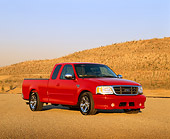 AUT 14 RK0329 03
2000 Ford Roush F-150 XLT Truck Red 3/4 Front View On Pavement By Hills Blue Sky