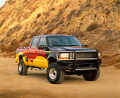 AUT 14 RK0335 03
2000 Ford F-350 4X4 Crew Cab Steel Horse Custom 3/4 Front View On Dirt By Mountain