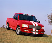 AUT 14 RK0362 03
1997 Ford F150 Thoroughbred with Cobra Engine Red 3/4 Front View On Grass Hill