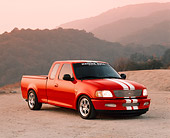 AUT 14 RK0369 04
1997 Ford F-150 Thoroughbred With Cobra Engine Red 3/4 Front View On Dirt In Mountains