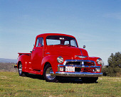 AUT 14 RK0387 03
1954 Chevrolet 1/2 Ton Pickup Truck Red 3/4 Front View On Grass Blue Sky
