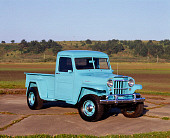 AUT 14 RK0397 02
1951 Willys Pickup Truck Light Blue 3/4 Front View On Pavement By Trees