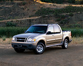 AUT 14 RK0413 02
2001 Ford Explorer Sport Trac 4x4 Gold 3/4 Front View On Dirt