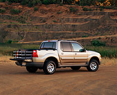 AUT 14 RK0415 04
2001 Ford Explorer Sport Trac 4WD Gold 3/4 Rear View On Dirt By Water