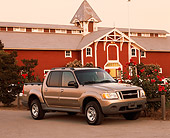 AUT 14 RK0417 04
2001 Ford Explorer Sport Trac 4x4 Gold 3/4 Front View On Pavement Building