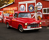 AUT 14 RK0422 01
1955 Chevy 1/2 Ton Pick Up Truck Red 3/4 Front View On Pavement By Barn