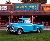 AUT 14 RK0426 02
1957 GMC 100 Series 1/2 Ton Pickup Truck Turquoise 3/4 Side View On Grass By Store