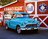 AUT 14 RK0432 02
1957 GMC 100 Series 1/2 Ton Pickup Truck Turquiose 3/4 Front View On Pavement By Barn