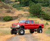 AUT 14 RK0510 02
2000 Ford F-350 4x4 Crew Cab Pick Up Red 3/4 Front View On Dry Grass