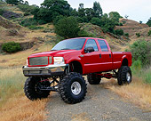 AUT 14 RK0512 02
2000 Ford F-350 4x4 Crew Cab Pick Up Red 3/4 Front View On Dry Grass Trees