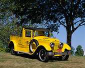 AUT 14 RK0515 03
1922 Lincoln AAA Tow Truck Yellow 3/4 Front View On Grass By Trees