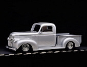 AUT 14 RK0663 01
1946 Chevrolet Pickup Silver 3/4 Side View On Checkered Line Studio