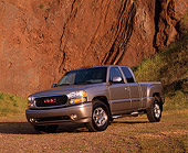 AUT 14 RK0665 02
2002 GMC Sierra Denali AWD 4 Door Pewter 3/4 Front View On Dirt Against Rock