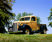 AUT 14 RK0675 01
1939 Chevrolet Pickup Truck Tan And Blue Low 3/4 Front View On Grass Trees Blue Sky