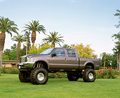 AUT 14 RK0699 04
2002 Ford F-350 Shadow Gray 3/4 Front View On Grass By Palm Trees And Flowers