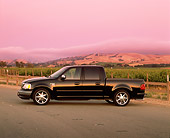 AUT 14 RK0727 01
2002 Ford F-150 XLT Black Profile View On Pavement By Vineyard Filtered