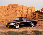 AUT 14 RK0748 03
2002 Chevy S10 Black Pick Up Truck 3/4 Side View By Hay Stacks