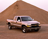 AUT 14 RK0767 02
2002 Chevy Silverado LS 2500HD 4WD Crew Pick Up Truck Pewter 3/4 Front View By Gravel Mound