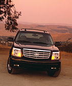 AUT 14 RK0793 01
2003 Cadillac Escalade EXT Black Head On View On Dirt Hills Background Filtered