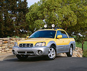 AUT 14 RK0795 01
2003 Suburu Baja 4WD Yellow Front 3/4 View On Pavement By Trees
