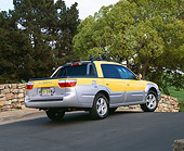 AUT 14 RK0796 01
2003 Suburu Baja 4WD Yellow Rear 3/4 View On Pavement By Trees