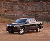 AUT 14 RK0800 02
2003 Avalanche 1500 4WD Dark Green 3/4 Front View On Dirt By Water